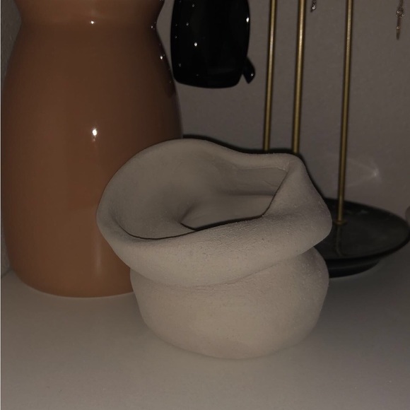 This is a cream white piece made with clay for decor around your house. - Picture 2 of 2